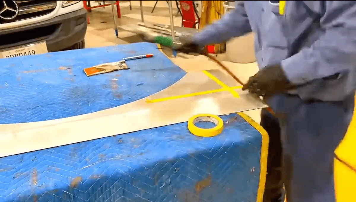 ATEL technician fabricating a custom heavy-duty part
